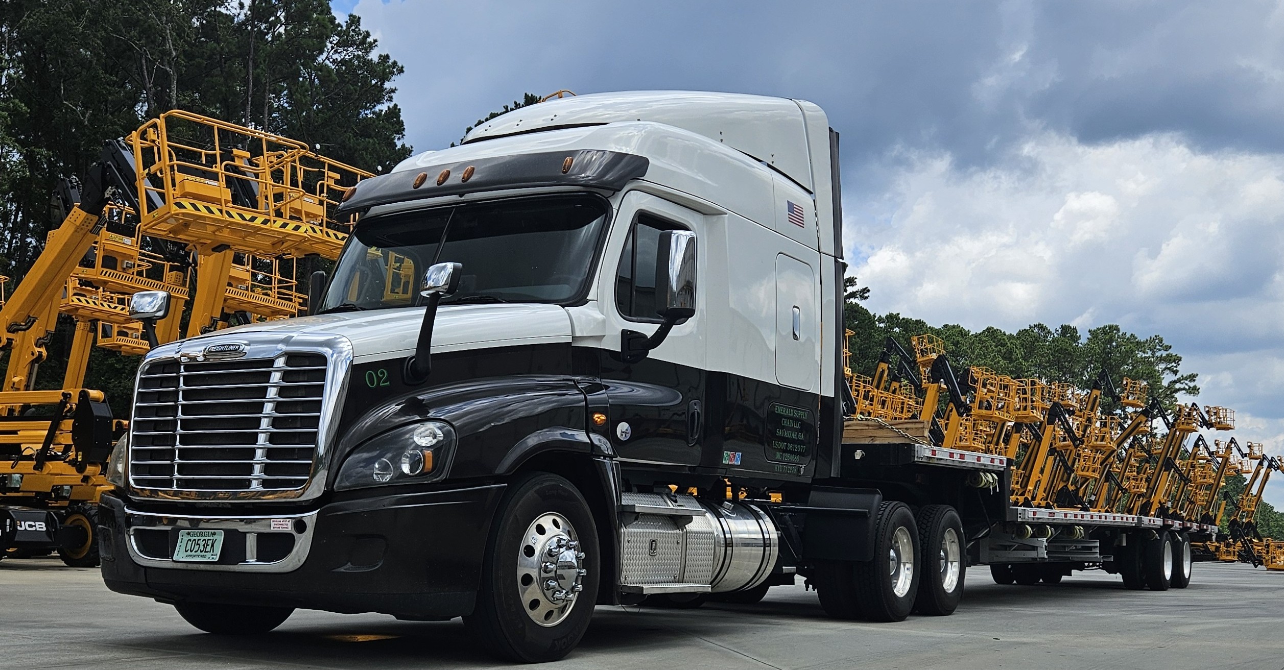 Emerald Supply Chain truck hauling equipment